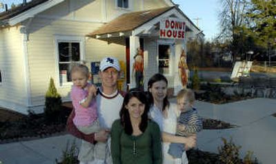 
Matt and April Gross stand in front of their business, The Donut House with their family, from left, Summer, 2, Savannah, 14, and Luke, 1.  
 (Kathy Plonka / The Spokesman-Review)