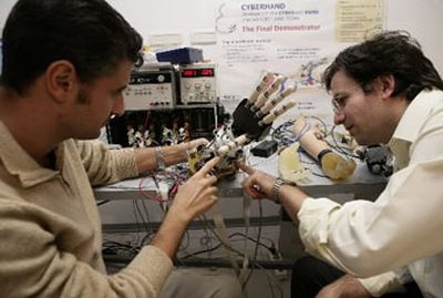 Engineers Franco Zaccone, left, and Stefano Roccella work on the latest Cyberhand model in the ArtsLab laboratory of the Polo Sant'Anna Valdera institute in the central Italian town of Pontedera, Italy.
(Associated Press / The Spokesman-Review)