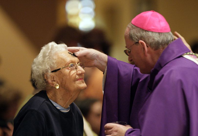 Helen Wisniewski, 94, is blessed by auxiliary Bishop John Noonan during Ash Wednesday services at St. Martha's Catholic Church on Wednesday Feb. 17, 2010 in Coral Gables, Fla. (Al Diaz / The Miami Herald)