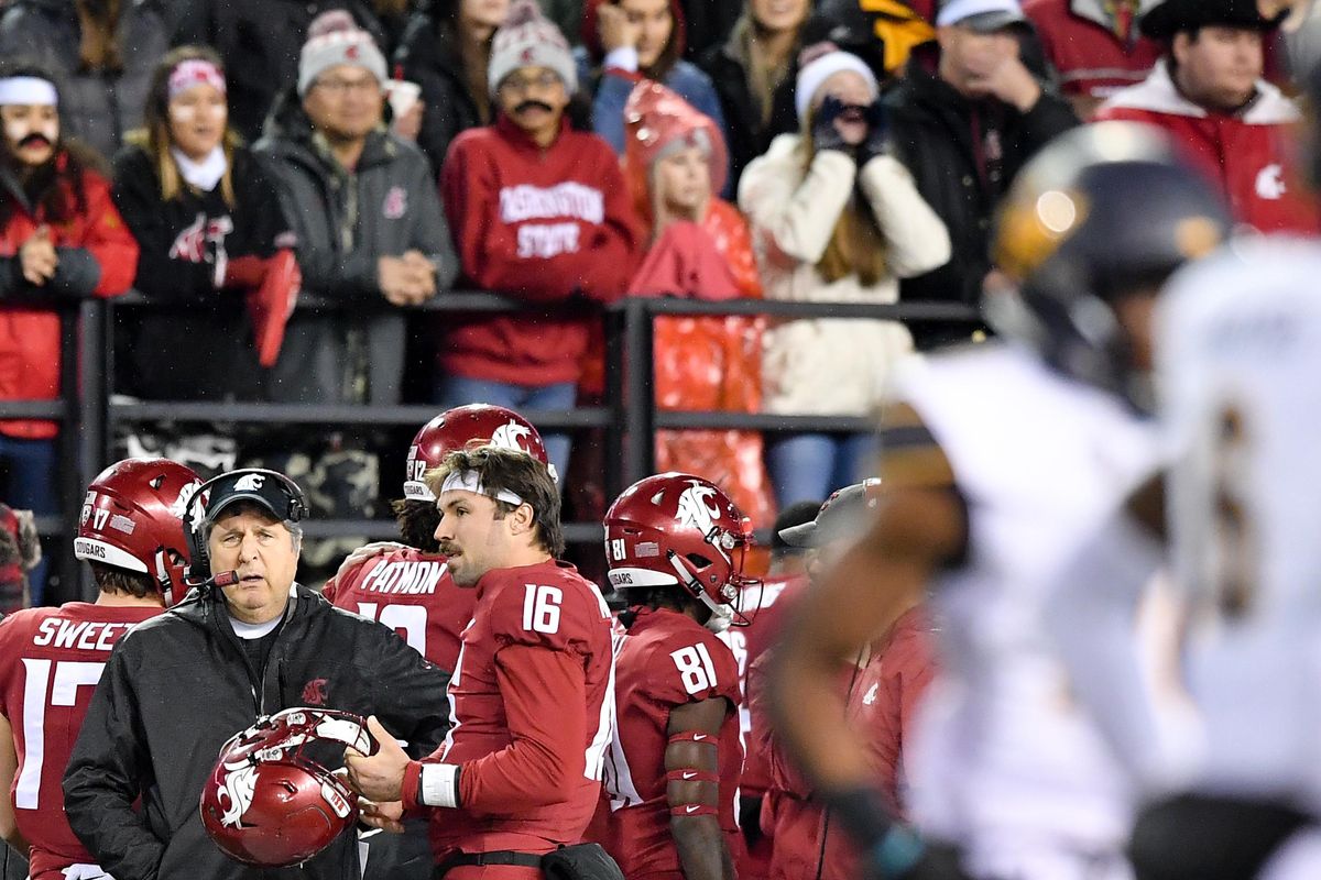 Washington State Cougars head coach Mike Leach speaks with quarterback Washington State Cougars quarterback Gardner Minshew (16) after WSU was forced to punt during the first half of a college football game on Saturday, November 3, 2018, at Martin Stadium in Pullman, Wash. (Tyler Tjomsland / The Spokesman-Review)