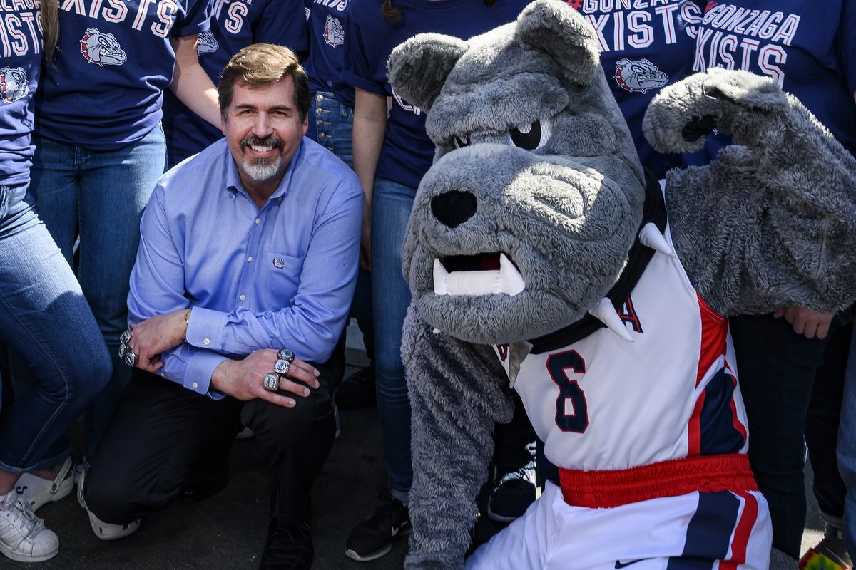 In this March 28, 2019 photo, Gonzaga President Thayne McCulloh joins band members and mascot Spike for a photo during a pre-game social in Anaheim, Calif.  (COLIN MULVANY/THE SPOKESMAN-REVIEW)