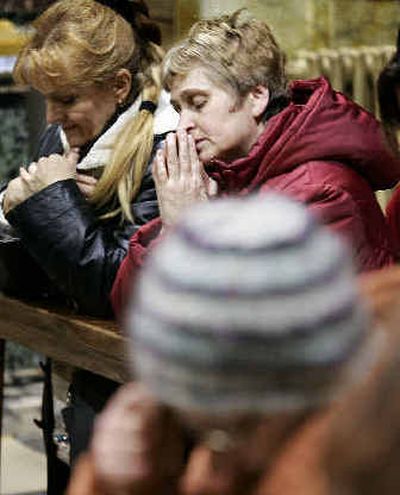 
People in Rome's St. Stanislaw Church pray for the pope's recovery on Thursday. 
 (Associated Press / The Spokesman-Review)