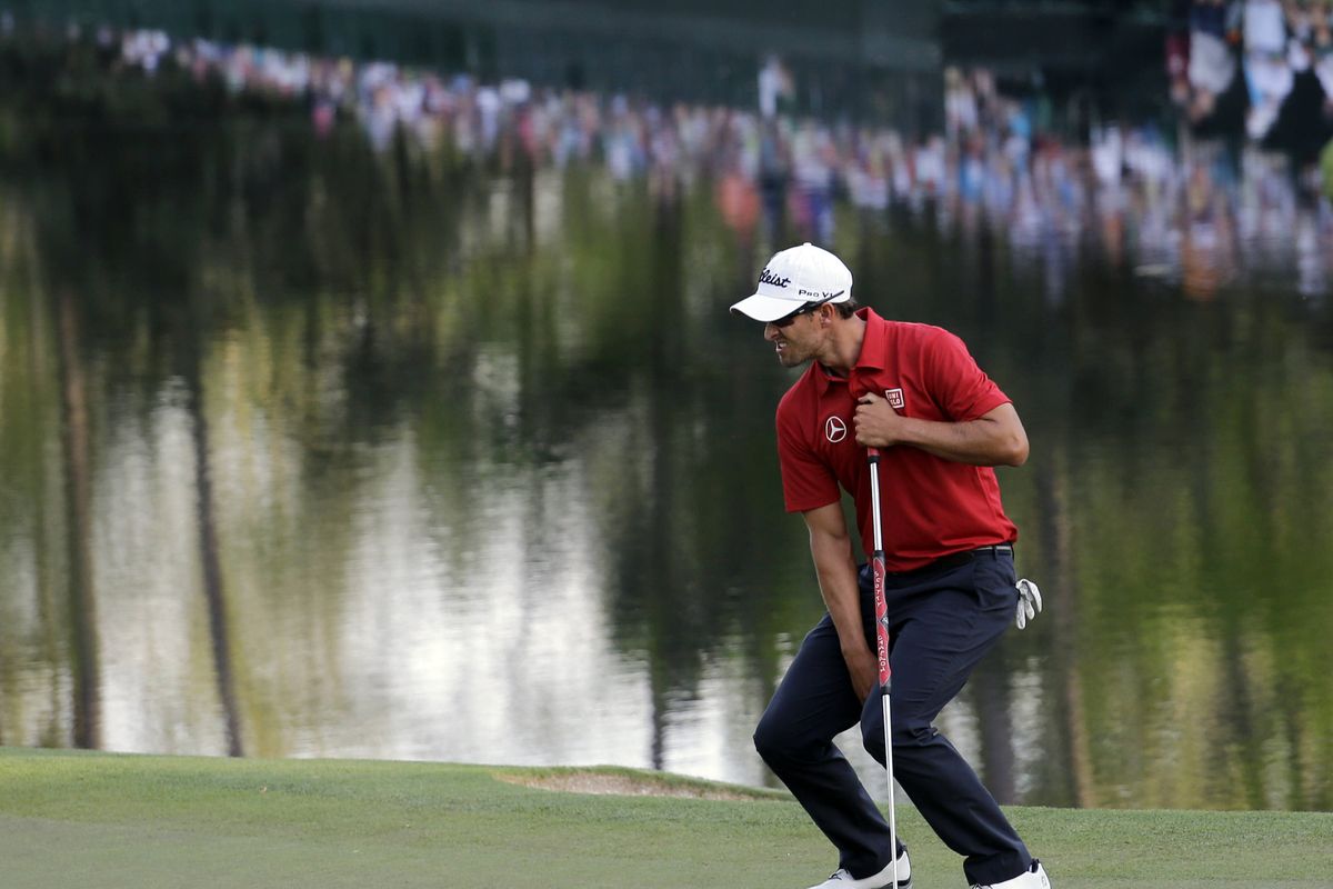 Adam Scott agonizes after missing a putt on the 16th green during the second round of the Masters. He shot a 72 on Friday. (Associated Press)