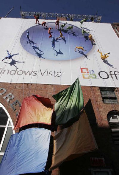
Dancers scale the wall of a New York building to promote the launch of the long-awaited Vista operating system from Microsoft on Monday. The software goes on sale today. 
 (Associated Press / The Spokesman-Review)