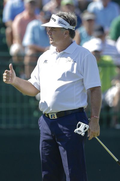 Kenny Perry gives the thumbs-up sign after finishing the 18th hole Thursday in the first round of the U.S. Senior Open. (Associated Press)