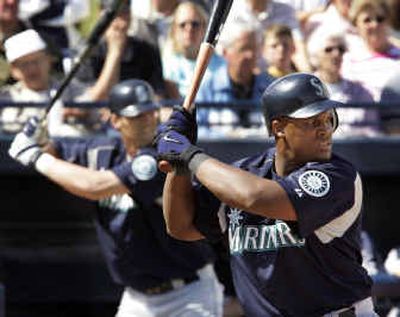 
Seattle's Richie Sexson, left, follows the ball from the on-deck circle as fellow Mariners slugger Adrian Beltre bats. Beltre has become a quiet team leader, according to manager Mike Hargrove. 
 (Associated Press / The Spokesman-Review)