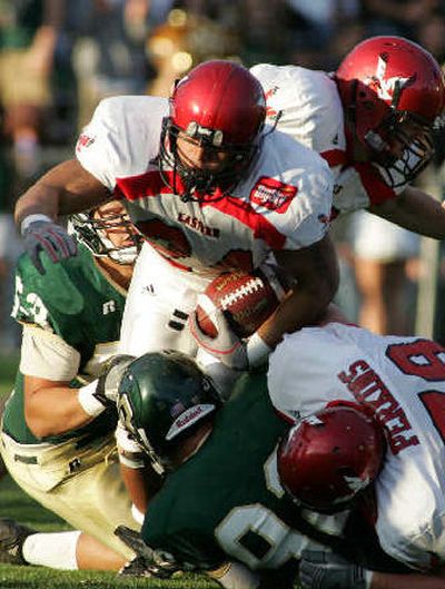 
EWU's Ryan Cole tries to push through the Cal Poly defense. 
 (Nick Hoover/Special to / The Spokesman-Review)