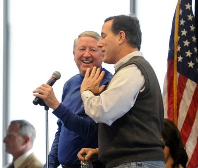 During the 2012 presidential campaign, Rick Santorum made a stop in Coeur d'Alene on Valentine's Day. Here, Jerry Jaeger, left, partner in Hagadone Hospitality, brags that presidential candidate Rick Santorum hit two balls onto the Resort Golf Course' floating green at the Hagadone Events Center. Now, Santorum has jumped on board the Trump Express. (Jesse Tinsley/SR file photo) 