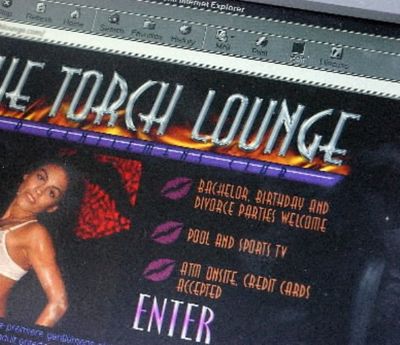 The web site of The Torch Lounge in Boise features profiles of its bikini dancers and images of scantily clad women taking showers. (Photo from Torch Lounge website in Boise, shortly before another bikini bar opened in Coeur d'Alene)