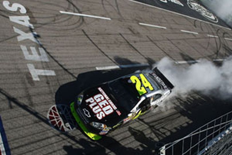 Jeff Gordon, driver of the No. 24 National Guard GED Plus Chevrolet, celebrates his first career win in 17 starts at Texas Motor Speedway following the NASCAR Sprint Cup Series Samsung 500. (Photo Credit: Jonathan Ferrey/Getty Images) (Jonathan Ferrey / The Spokesman-Review)