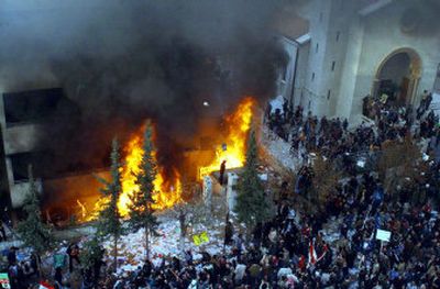 
Thousands of angry Syrian demonstrators storm the Danish Embassy in Damascus, Syria, on Saturday and set fire to the embassy building in protest of offensive caricatures of Islam's prophet.  
 (Associated Press / The Spokesman-Review)