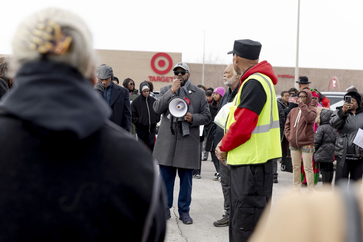 The Rev. Charles Williams II speaks to a crowd of pastors and parishioners from Black churches in the Detroit area on Feb. 23, during a “good-buy” Sunday at a Target in Southfield, Mich. (Sylvia Jarrus/For The Washington Post)
