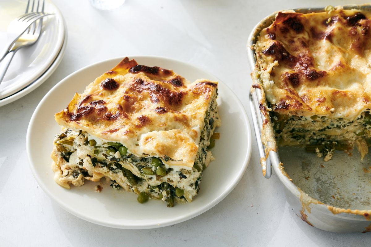Layered with asparagus, spinach, peas and lemony ricotta, this springy recipe from Melissa Clark is the cheesy dish for right now. (DAVID MALOSH/New York Times)
