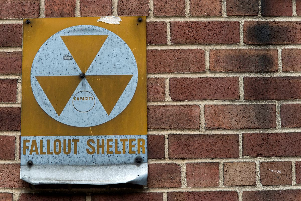 FILE - A fallout shelter sign hangs on a building on East 9th Street in New York, Jan. 16, 2018. According to a new poll from The Associated Press-NORC Center for Public Affairs Research, close to half of Americans say they are very concerned Russia would directly target the U.S. with nuclear weapons, and 3 in 10 are somewhat concerned about that.  (Mary Altaffer)