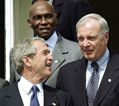 
President George Bush chats with Canadian Prime Minister Paul Martin, right, as Sengalese President Abdoulaye Wade, back, looks on.
 (Associated Press / The Spokesman-Review)