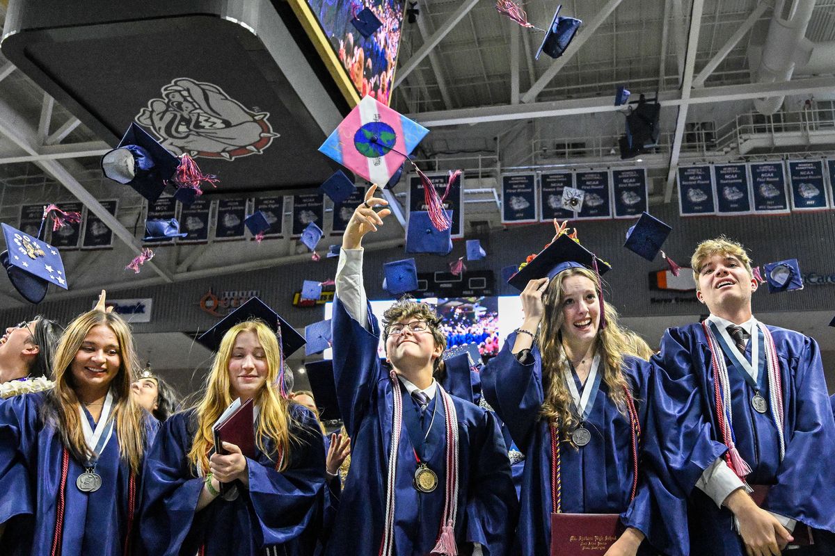 At the end of their graduation ceremony, students from the Mt. Spokane class of 2024 toss their caps in the air Friday at McCarthey Athletic Center.  (COLIN MULVANY/THE SPOKESMAN-REVIEW)