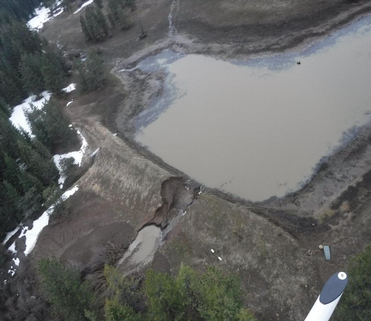 An illegal dam in Asotin County failed in April 2017, wiping out trees and vegetation, moving boulders, damaging a state highway and destroying a bridge that had been the only point of access to a neighboring ranch. The dam break also damaged miles of habitat for endangered steelhead trout. (Washington Department of Ecology)