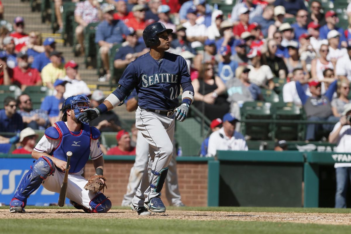 Seattle Mariners Robinson Cano (22) watches as his hit goes for a two-run home run during the ninth inning of a baseball game against the Texas Rangers Wednesday, April 6, 2016, in Arlington, Texas. (Brandon Wade / Associated Press)