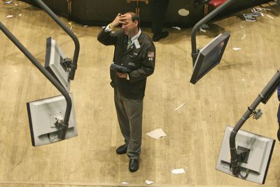 A trader works on the floor of the New York Stock Exchange on Monday in New York.  (Associated Press / The Spokesman-Review)