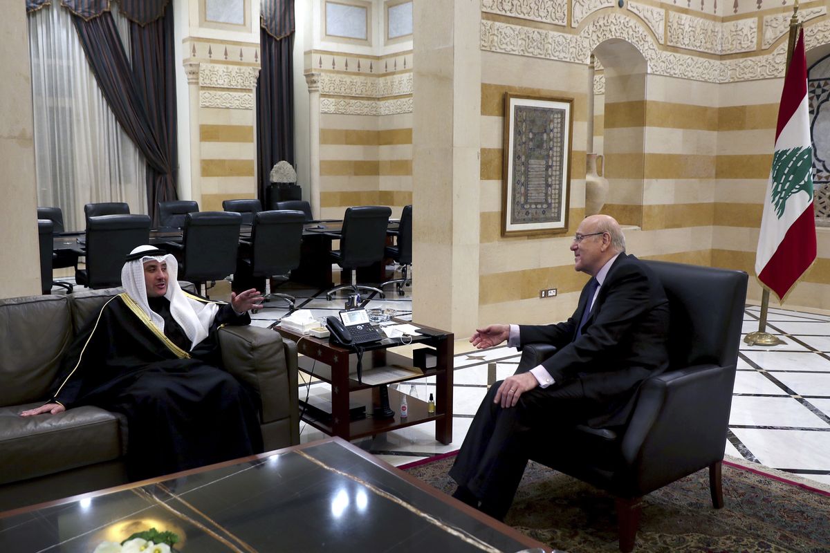 Lebanese Prime Minister Najib Mikati, right, meets with Kuwaiti Foreign Minister Sheikh Ahmad Nasser al-Mohammad al-Sabah in Beirut, Lebanon, Saturday, Jan. 22, 2022.  (Bilal Hussein)