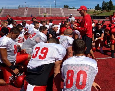 Eastern Washington coach Beau Baldwin addresses his players after Saturday’s scrimmage. (Jim Allen / The Spokesman-Review)