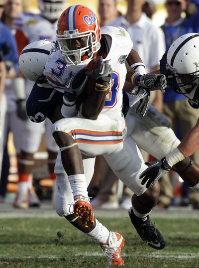 Penn State safety Stephen Obeng-Agyapong drags down Florida receiver Chris Rainey. (Associated Press)