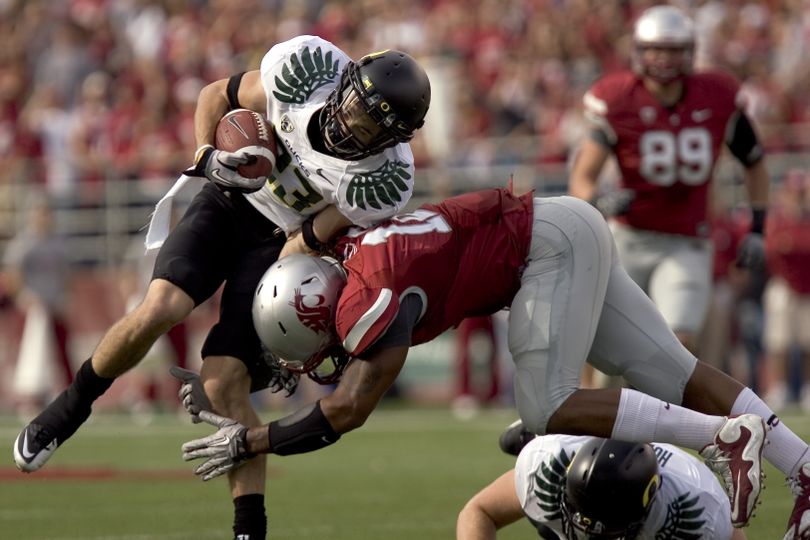 Oregon wide receiver Jeff Maehl, top, gets tackled by Washington State linebacker C. J. Mizell during the first quarter of an NCAA college football game Saturday, Oct. 9, 2010, at Martin Stadium in Pullman, Wash. Maehl had 10 receptions for 119 yards. Oregon won 43-23. (Dean Hare / Fr158448 Ap)