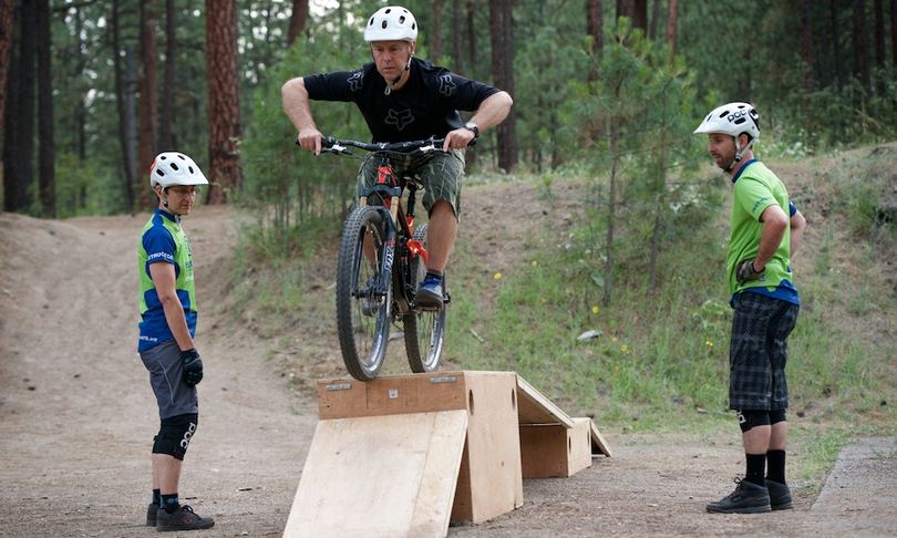Certified mountain biking instructors from  Evergreen East coach a student in the club's Intermediate Skills Class at Camp Sekani. (Evergreen East)
