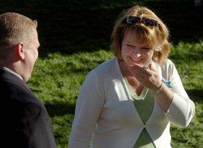 
Susan DeLano, of the Wishing Star Foundation, learns from auctioneer Matt Backs that the organization brought in more than $6,000 at the Fountain of Wishes auction Saturday evening  in Coeur d'Alene. 
 (Jesse Tinsley / The Spokesman-Review)