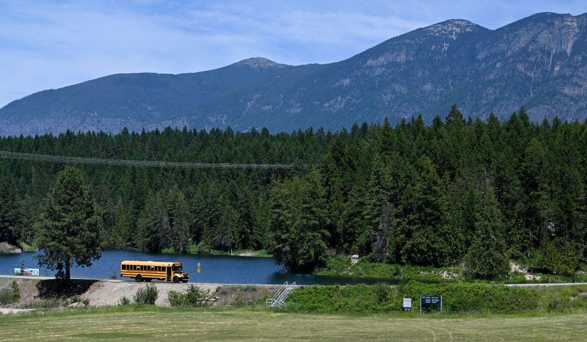 A bus crosses from Canada to the United States for a cross-border, pop-up vaccination clinic held between the Kootenai Tribe of Idaho and the Lower Kootenay Band of British Columbia on Monday, June 21, 2021 at the Porthill Point of Entry north of Bonners Ferry. The event was deliberately held on Canada’s National Indigenous Peoples Day and utilized buses to shuttle members of the Lower Kootenay Band of British Columbia and several community members from Creston, B.C. to the U.S., where Kootenai Tribal Health Clinic staff were waiting to board the buses and administer doses of the COVID-19 vaccine.  (Tyler Tjomsland/The Spokesman-Review)