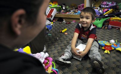 Comrad Hawthorn, 3, finds what he was looking for at St. Vincent DePaul Thrift store on Tuesday. Comrad and his mom, Tiffany Carson, are regulars at the store in Coeur d’Alene.  (Kathy Plonka / The Spokesman-Review)