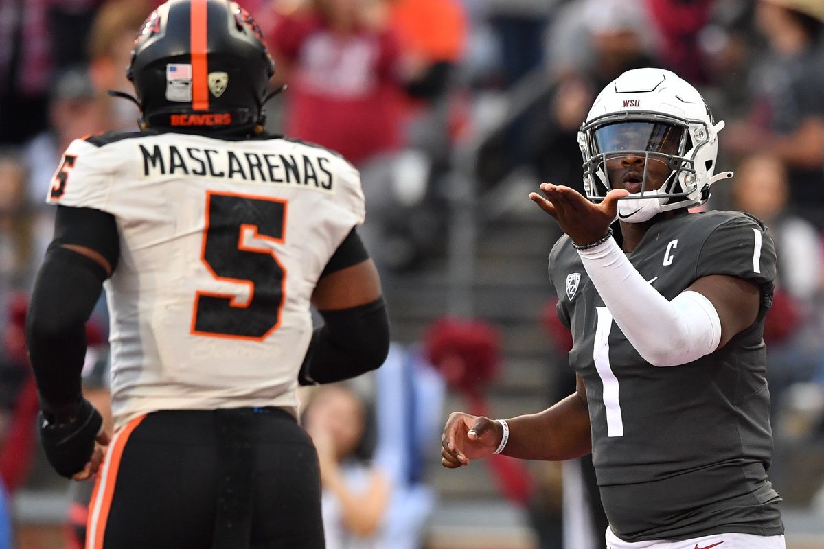 Washington State Cougars quarterback Cameron Ward (1) blows a kiss to Oregon State Beavers linebacker Easton Mascarenas-Arnold (5) after throwing a touchdown pass to wide receiver Josh Kelly (3) during the second half of a college football game on Saturday, Sept. 23, 2023, at Martin Stadium in Pullman, Wash. WSU won the game 38-35.  (Tyler Tjomsland/The Spokesman-Review)