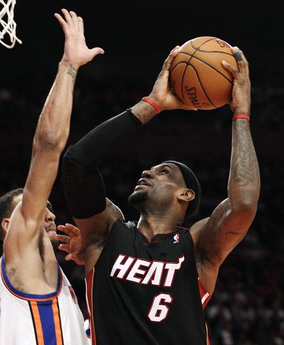 LeBron James scored 32 points as Heat took 3-0 lead over Knicks in East quarters. (Associated Press)