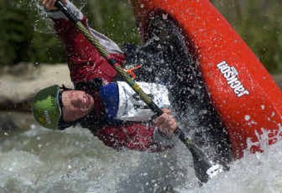 
Pro kayaker Nick Troutman from Canada, in mid-flip during the second-annual Reno River Festival at Wingfield Park and in the Truckee River whitewater park earlier this month. Friends of the Falls is planning to begin construction of a whitewater park near High Bridge in Spokane next summer.
 (Photos by Scott Sady/Reno Gazette Journal / The Spokesman-Review)