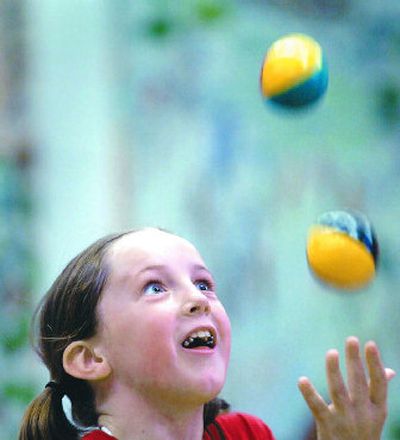 
Jessica Marshall, a third-grader at Sorensen Elementary in Coeur d'Alene, juggles  for the rest of the students at the annual talent show on Friday. The school, which supporters hope to turn into a magnet school for performing and visual arts, will  raise  money for the programs at a fundraiser  this evening. Students will perform during the program. 
 (Jesse Tinsley / The Spokesman-Review)
