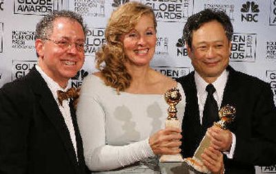 
Director Ang Lee, right, is joined by producer James Schamus, left, and co-writer Diana Ossana as they pose with the award they won for best dramatic motion picture for 