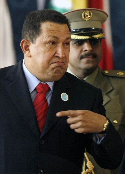 Venezuelan President Hugo Chavez speaks with photographers in Doha, Qatar, on Tuesday.  (Associated Press / The Spokesman-Review)