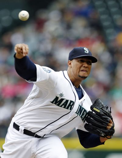 Seattle Mariners starting pitcher Hector Noesi throws against the Los Angeles Angels in the second inning in a baseball game, Sunday, May 27, 2012, in Seattle. (Elaine Thompson / Associated Press)