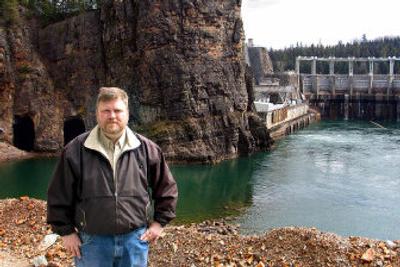 
Avista fish biologist Tim Swant says two tunnels, shown at the upper left, may have to be reopened as Avista searches for ways to stop bubble disease in fish. The tunnels were dug in the 1950s to divert the Clark Fork River during construction of the Cabinet Gorge Dam in Idaho. 
 (John Stucke / The Spokesman-Review)