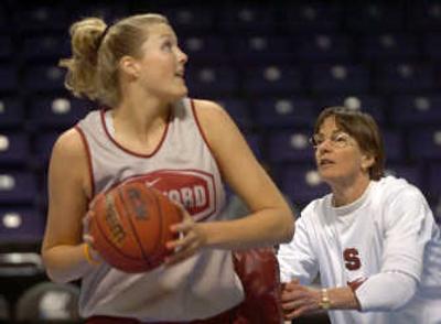 
Stanford coach Tara VanDerveer, right,  bumps Jayne Appel, with a pad to simulate rough contact as Appel practices Friday. 
 (Jesse Tinsley / The Spokesman-Review)