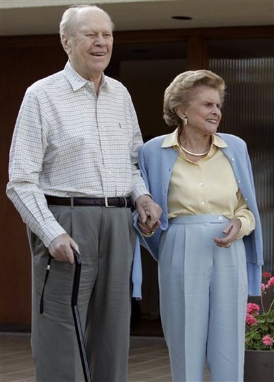 Former President Gerald Ford and former first lady Betty Ford smile outside their home in Rancho Mirage, Calif., in April 2006. A family friend said Friday that Betty Ford had died at the age of 93.  (Associated Press / File)