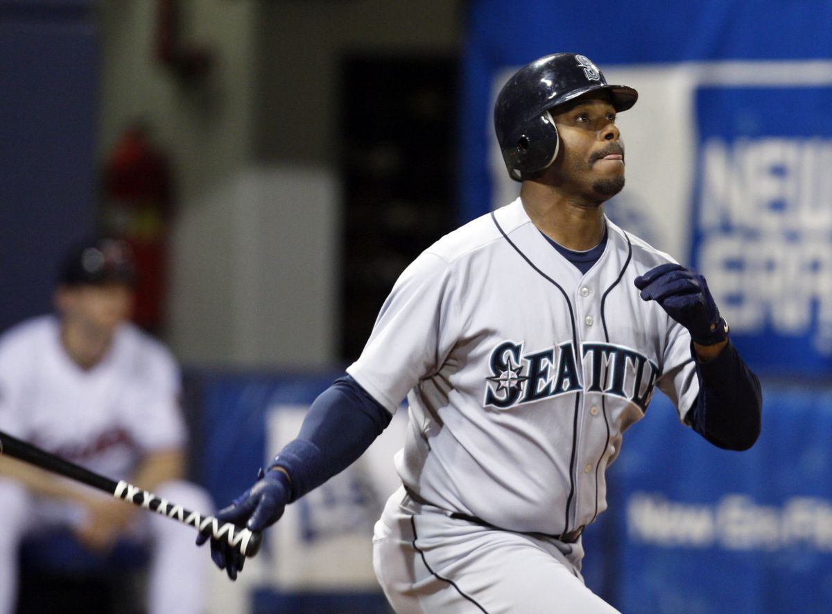 Ken Griffey Jr. connects for a solo home run. (Associated Press / The Spokesman-Review)