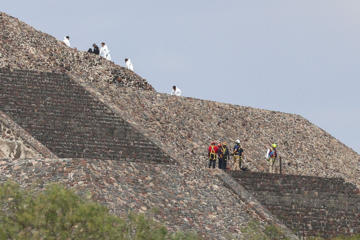 Mexican authorities work at the scene where a man shot dead a Canadian woman and injured several others before killing himself, Mexico