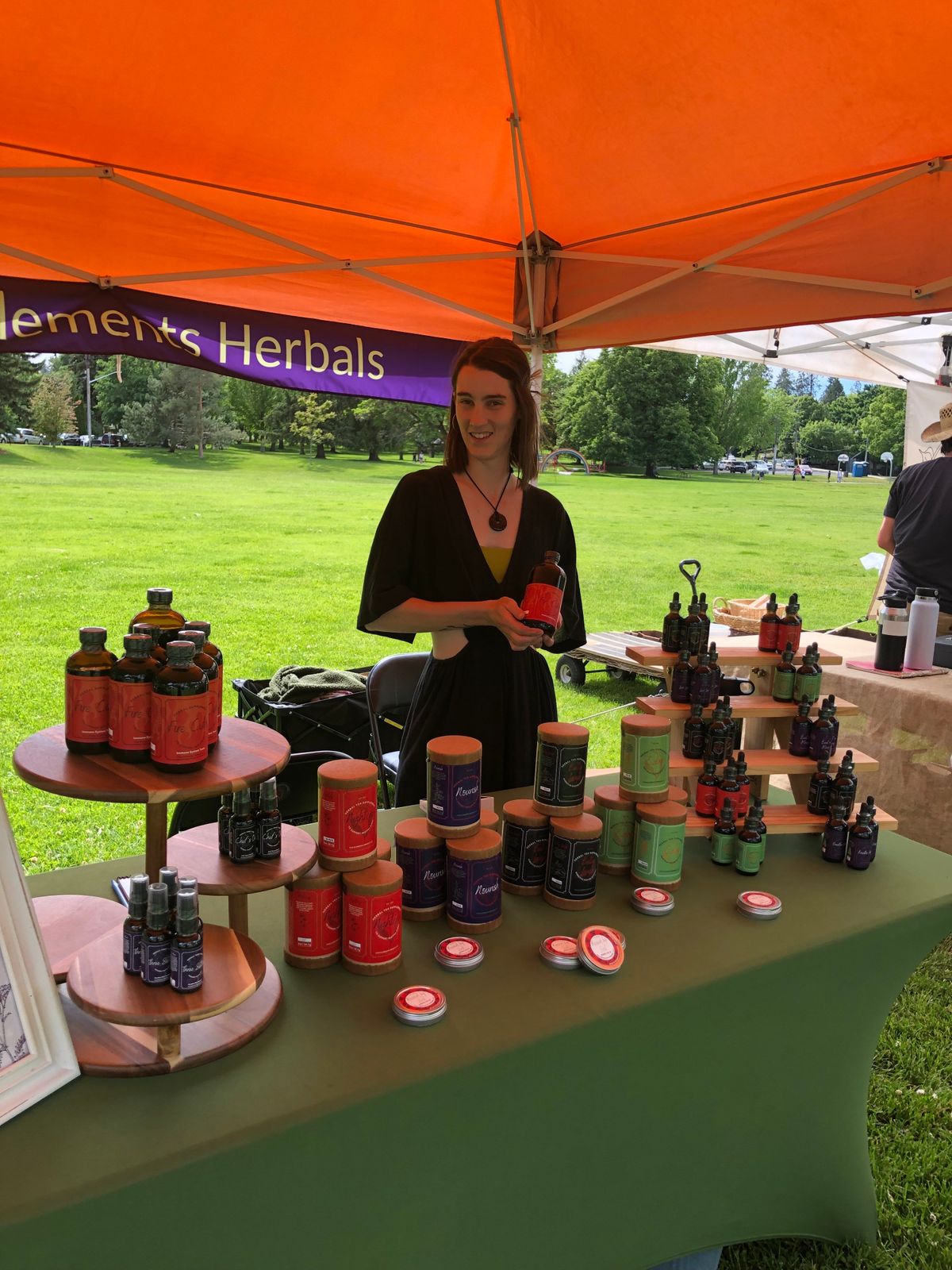 Rachel Clark poses with her line of herbs, Five Elements Herbals. Clark is the host of the series From Garden to Cup, being held at Shadle Library this month.  (Courtesy)