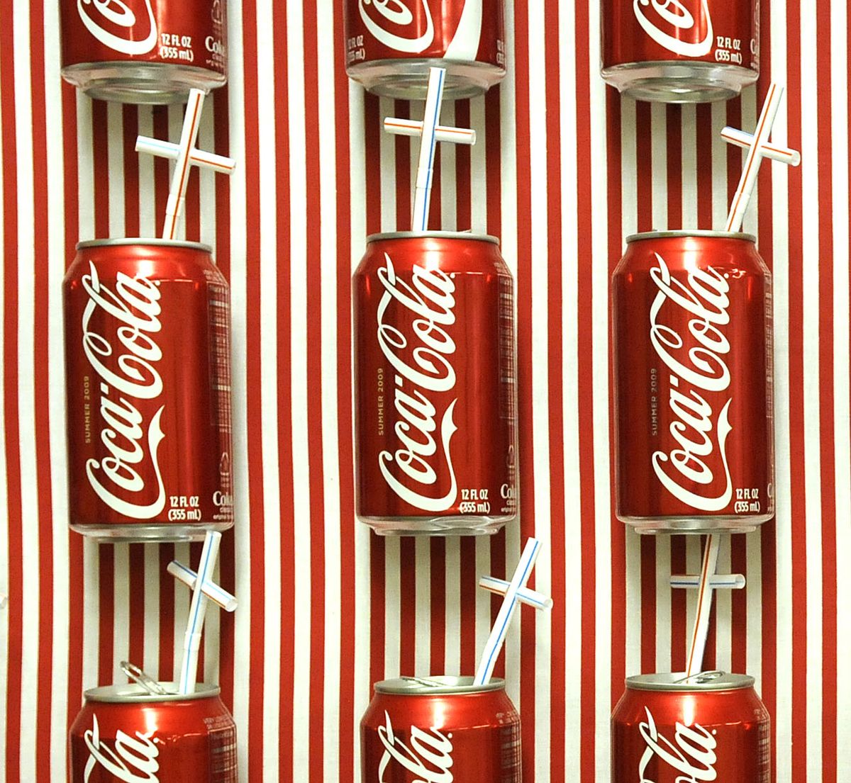 Straws shaped like crosses adorn a wall of Coke cans as part of the Coeur d’Alene exhibit, opening tonight. (The Spokesman-Review)