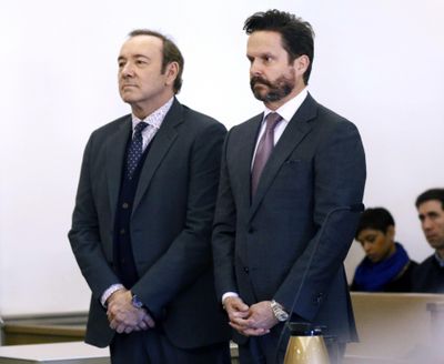 Actor Kevin Spacey stands with his attorney Alan Jackson, right, in district court during arraignment on a charge of indecent assault and battery on Monday, Jan. 7, 2019, in Nantucket, Mass. The Oscar-winning actor is accused of groping the teenage son of a former Boston TV anchor in 2016 in the crowded bar at the Club Car in Nantucket. (Nicole Harnishfeger / Associated Press)