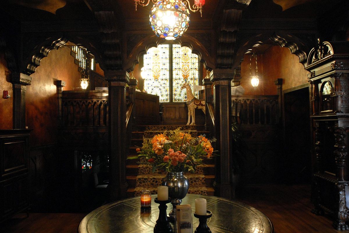 Grand carvings and trim work shine in the light of a stained glass window in the Patsy Clark Mansion in 2006. The woodwork in the Clark Mansion’s foyer was repaired and preserved by Walker Construction. The detailed carved woodwork took two years to complete. (The Spokesman-Review photo archive / SR)