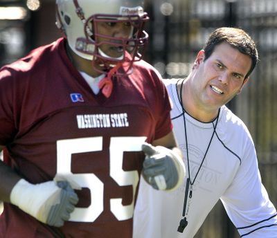 WSU coach Paul Wulff, right, is shaking up the lineup, including moving offensive lineman Vaughn Lesuma from left tackle to guard.  (Christopher Anderson / The Spokesman-Review)