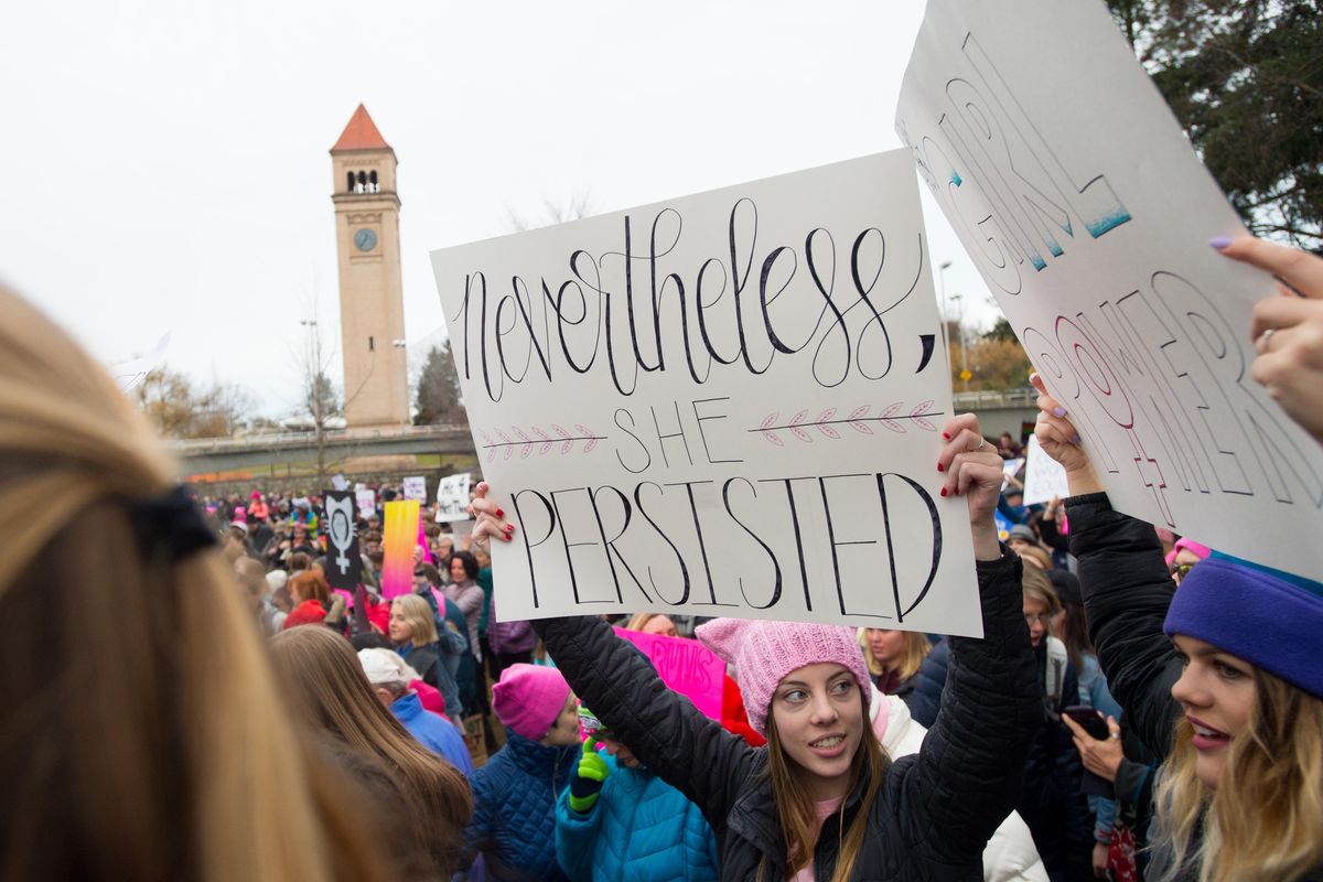 Nicole Lerch, in pink hat, prepares to march with her friend, Maddie Moen, right, during the 2018 Spokane Women’s Persistence March on Sunday in downtown Spokane. (Tyler Tjomsland / The Spokesman-Review)