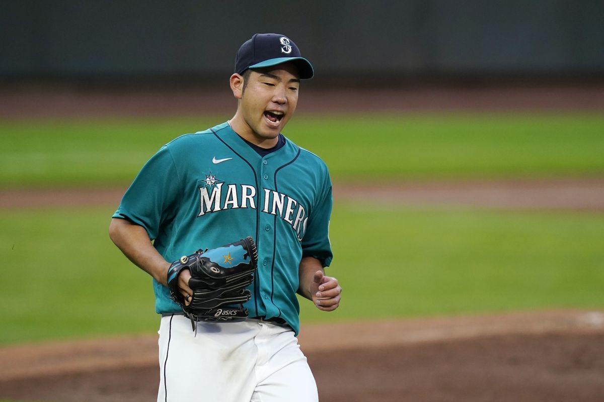 Mariners starting pitcher Yusei Kikuchi yells as Texas’ Eli White grounds out in the third inning Friday in Seattle.  (Associated Press)